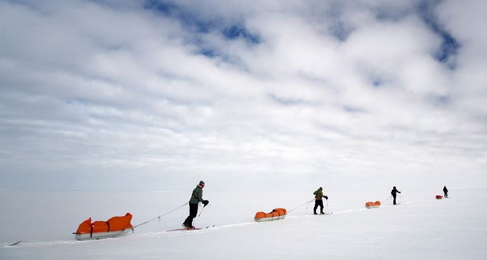 Skiers pulling sledges on route to South Pole, Antarctica