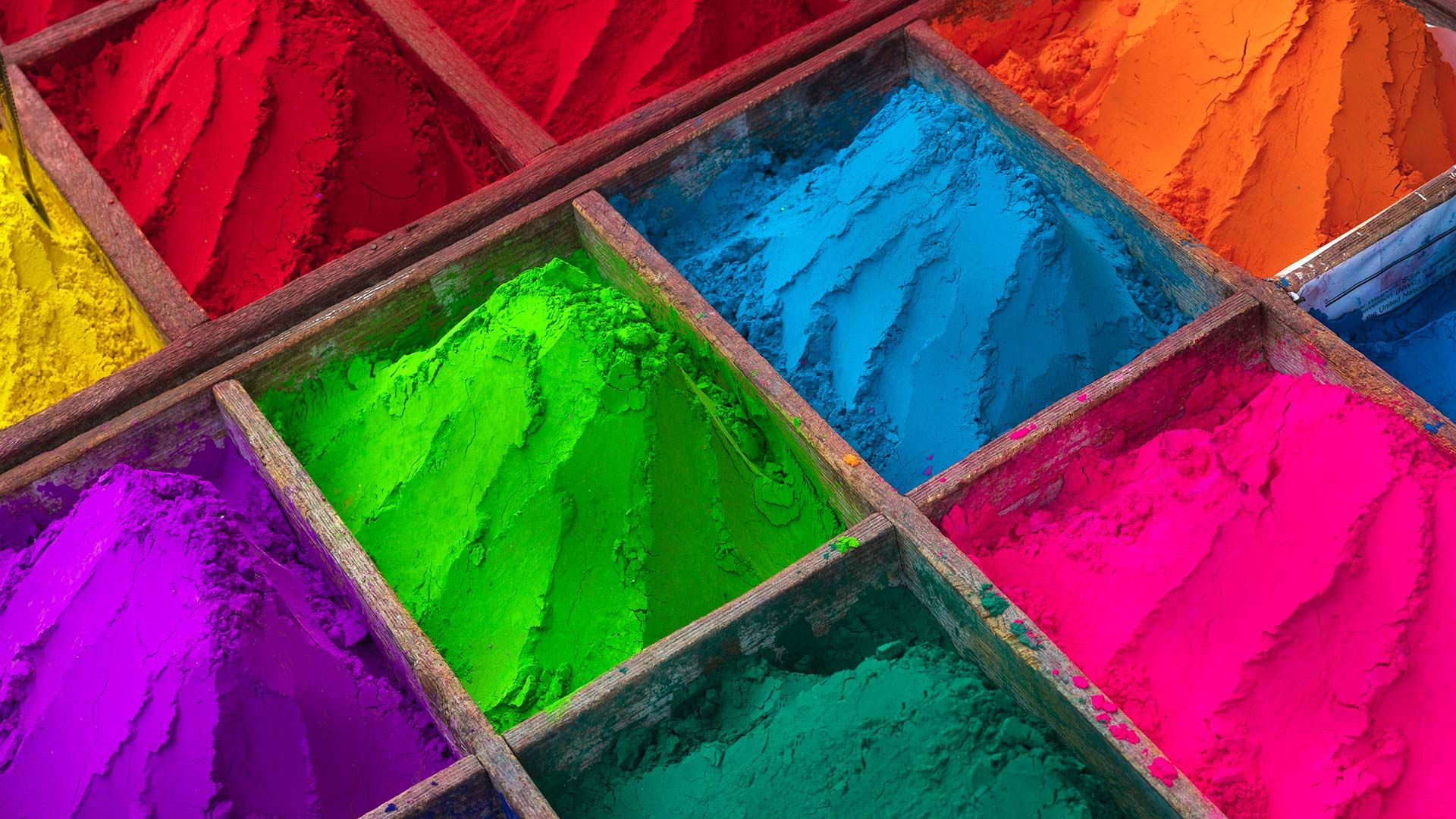 Brightly colored powder for sale during Holi