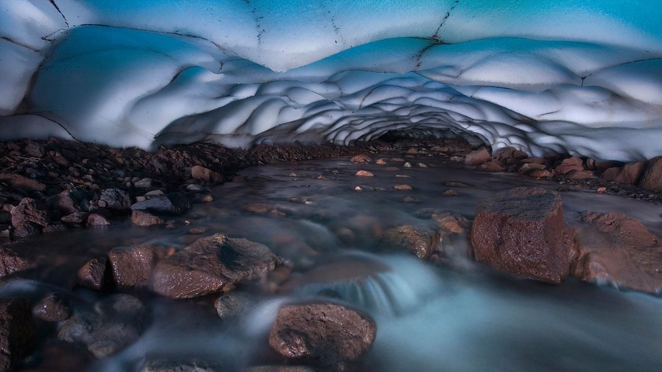 Ice cave and stream in Oregon's Three Sisters Wilderness, USA