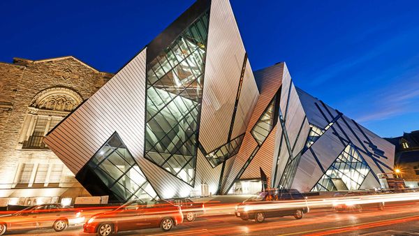 Façade of the \'Crystal\' extension of the Royal Ontario Museum illuminated at night, Toronto