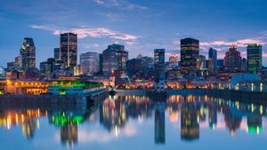 Montreal skyline reflecting in St. Lawrence River, Quebec (© Walter Bibikow/Stone/Getty Images)(Bing Canada)