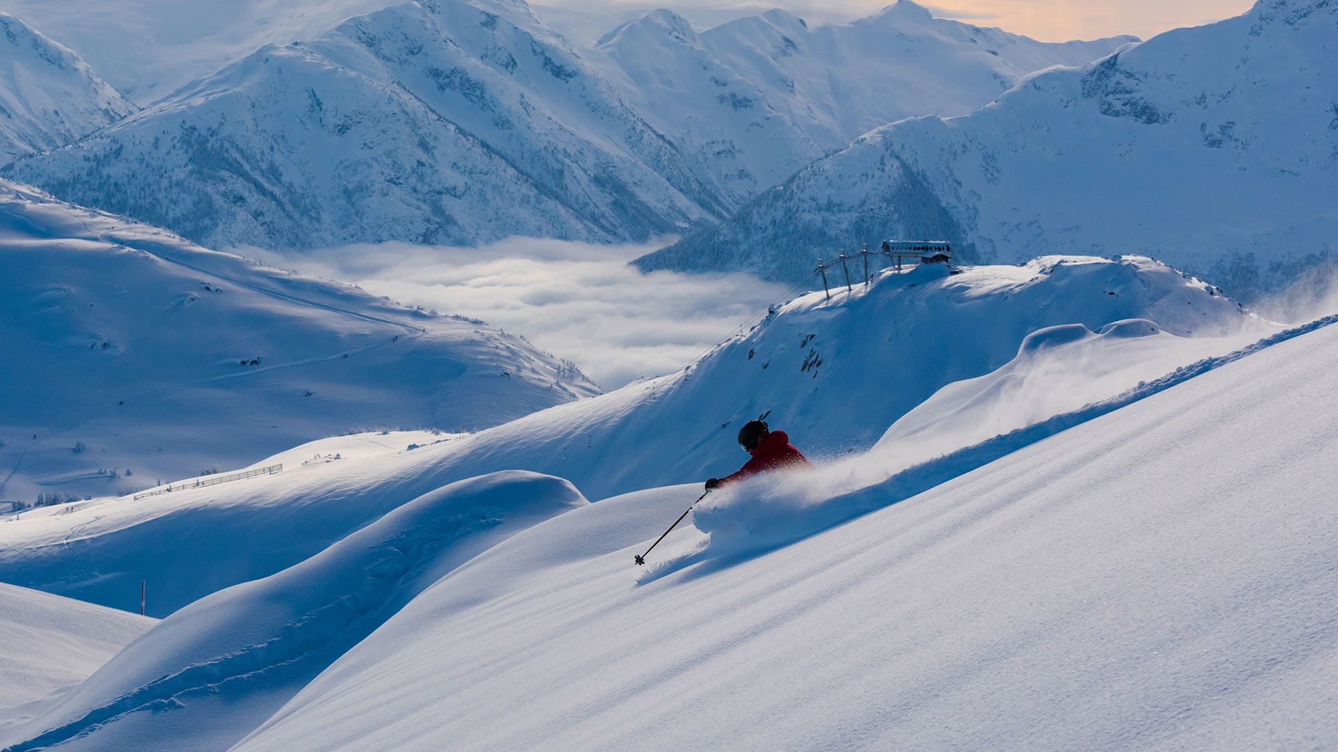 Skier making a turn in pristine snow in Whistler, B.C.