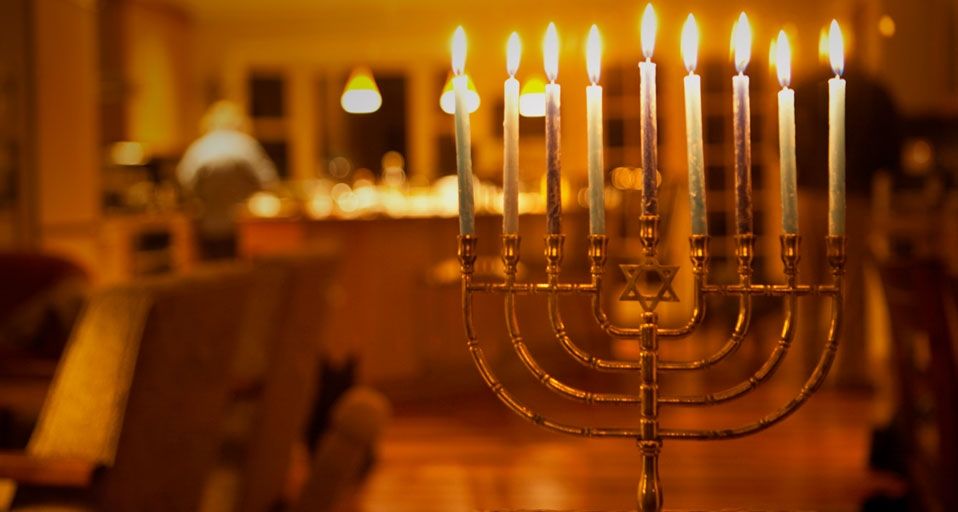Lit candles in a menorah