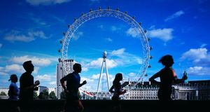 Joggers running by Thames, London Eye in background - Michael Betts/Getty Images &copy; (Bing United Kingdom)