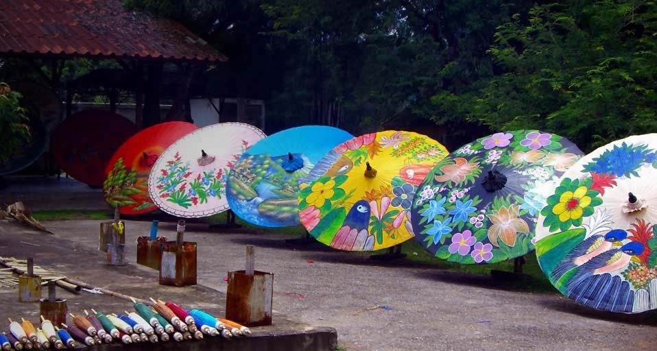 Hand-painted sa paper umbrellas for sale at a workshop in Chiang Mai, Thailand