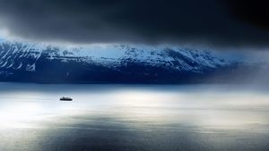 A ferry passes the Lyngen Alps in Norway (© Laurent Bouvet/Aurora Photos)(Bing New Zealand)