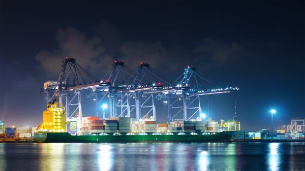 Cranes moving cargo at Laem Chabang Port, Thailand