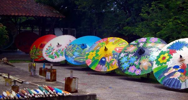 Hand-painted sa paper umbrellas for sale at a workshop in Chiang Mai, Thailand