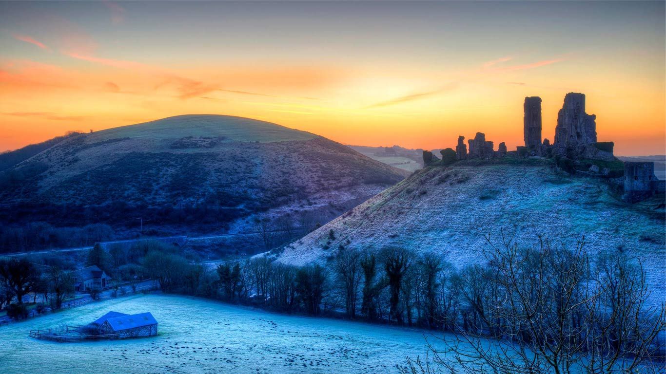 Colourful sunrise over Corfe Castle, Dorset, United Kingdom