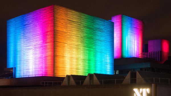 The National Theatre lit up in rainbow colours, London