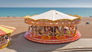 Golden Gallopers Carousel on the seafront in Brighton, East Sussex, England (© Graham Prentice/Alamy)(Bing Canada)