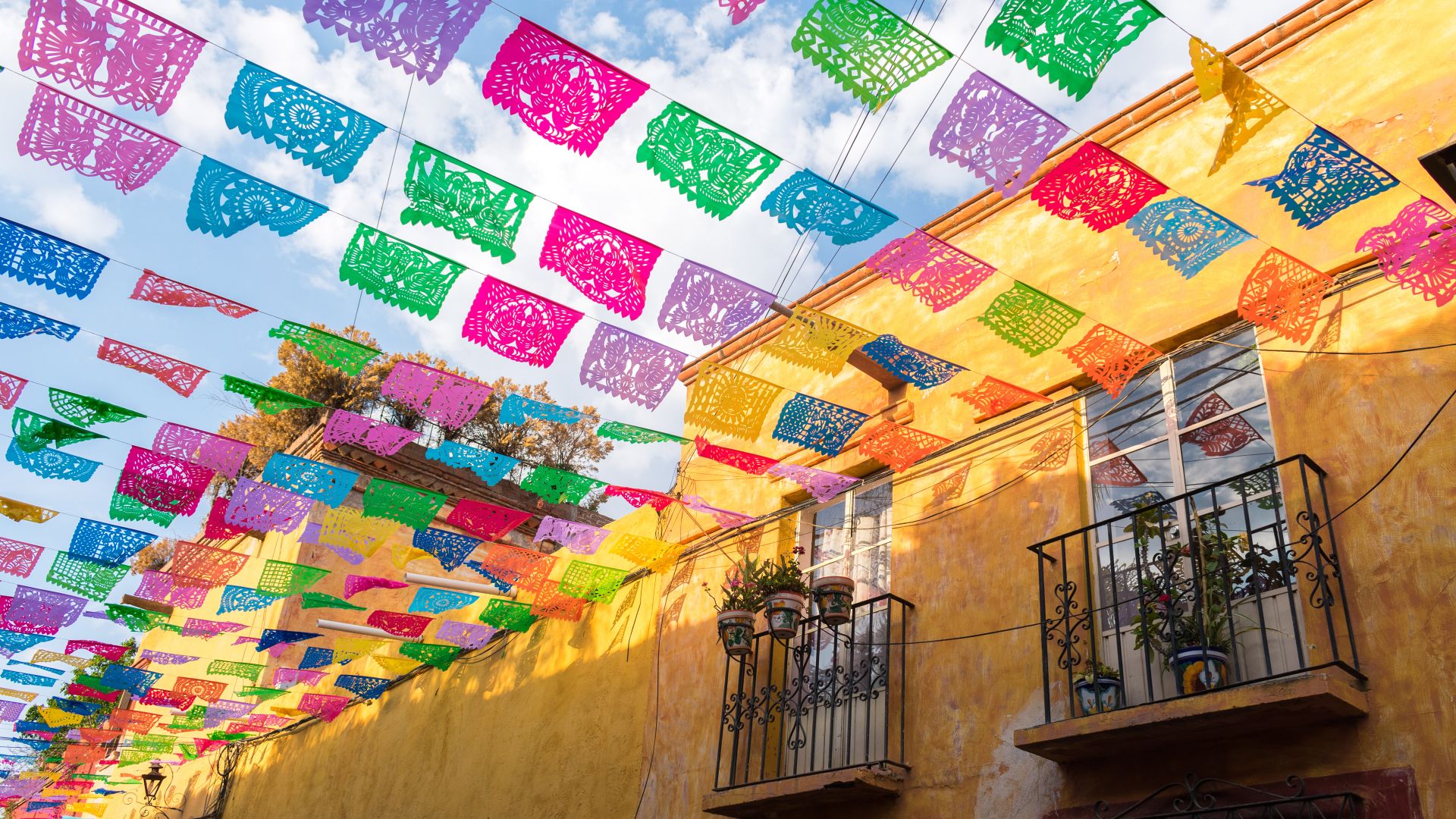 Paper flags strung over a street in San Miguel de Allende, Mexico