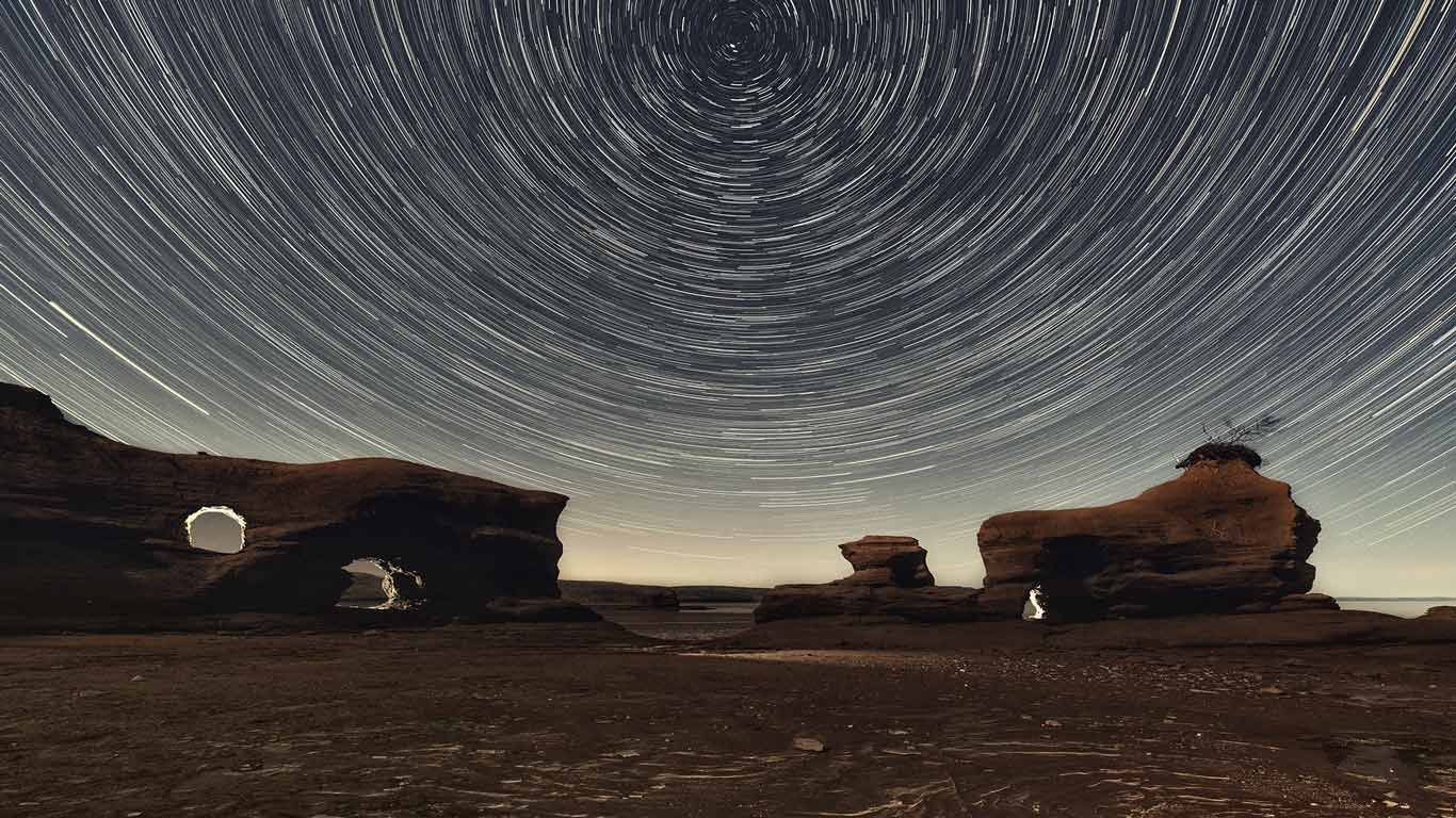 A Martian-esque landscape of sandstone arches in Nova Scotia's Minas Basin at low tide
