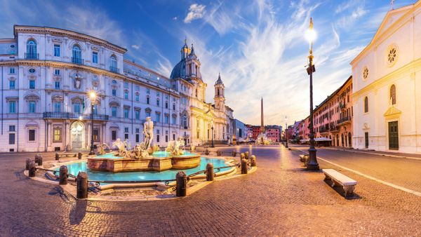 Piazza Navona with the Moor Fountain and Basilica at sunset, Rome, Italy