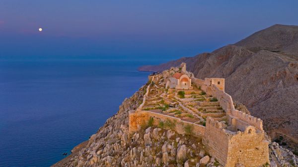Ruins of the medieval castle of the Knights of St John above the village of Chorio, Halki Island, Greece