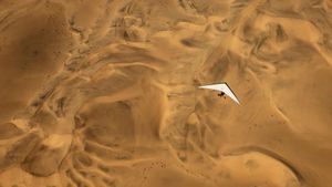 An ultralight aircraft flying over the sands of Namibia (© Burt Johnson/Alamy Stock Photo)(Bing Canada)