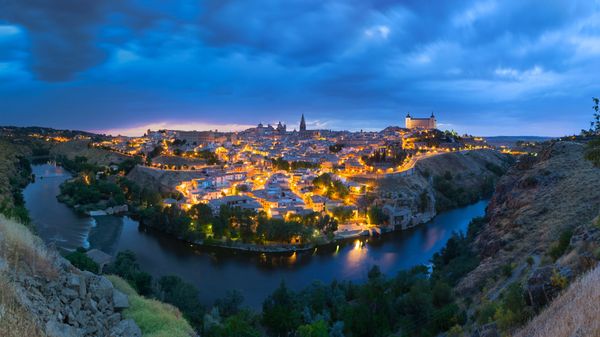 Panoramic view of the city of Toledo after sunset, Spain