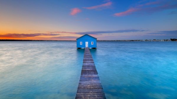 Sunrise over the Matilda Bay boathouse in the Swan River, Perth, Australia