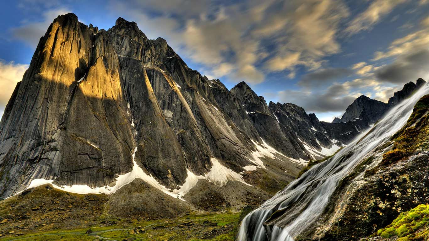 Flowing glacial creek with Mount Harrison Smith in background, Cirque of Unclimbables, Nahanni National Park, Northwest Territories