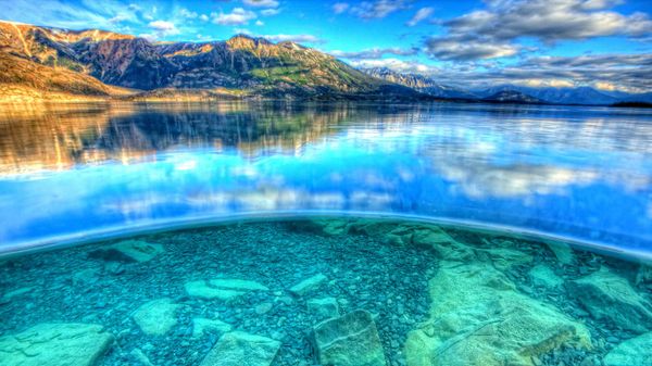 The view above and below water in Atlin Lake, Atlin Lake Provincial Park, British Columbia, Canada