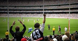 Supporters at AFL game, Melbourne Cricket Ground, Victoria, Australia -- Andrew Watson/Axiom &copy; (Bing Australia)