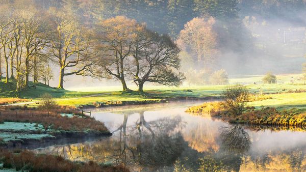 Misty sunrise on the River Brathay in the Lake District, Cumbria