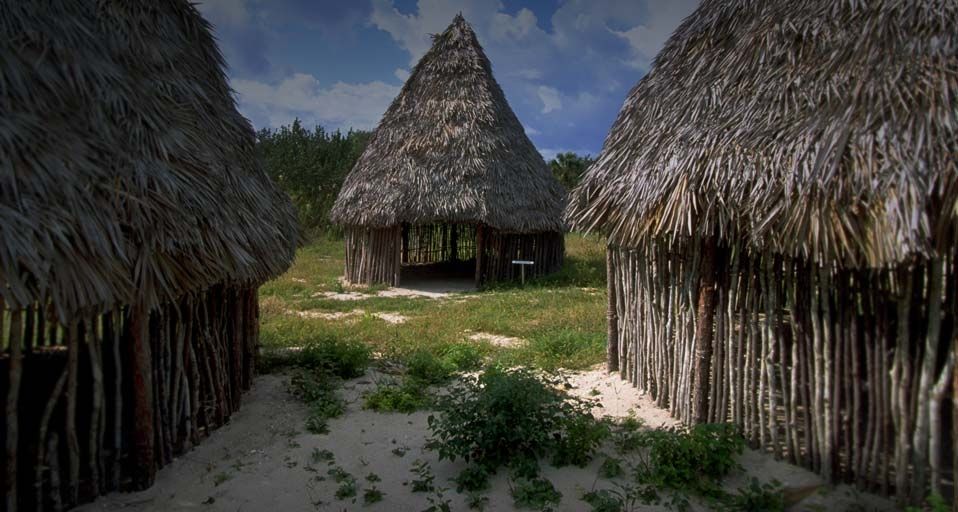Replica huts at Guanahani Landfall Park on San Salvador island in the Bahamas