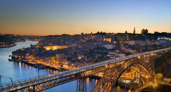 The Dom Luis I bridge and city of Porto, Portugal, at sunset