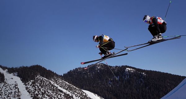 Richard Spalinger of Switzerland (L) and Thomas Zangerl of Austria compete in Men's Ski Cross at the Vancouver 2010 Winter Olympics on February 21, 2010