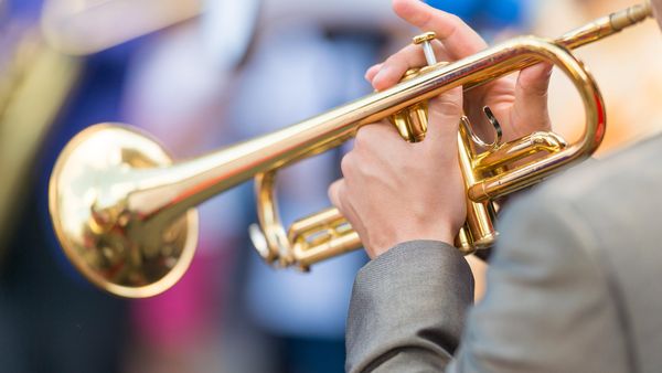 Close-up of a trumpet player\'s hands at Festival International de Jazz de Montréal