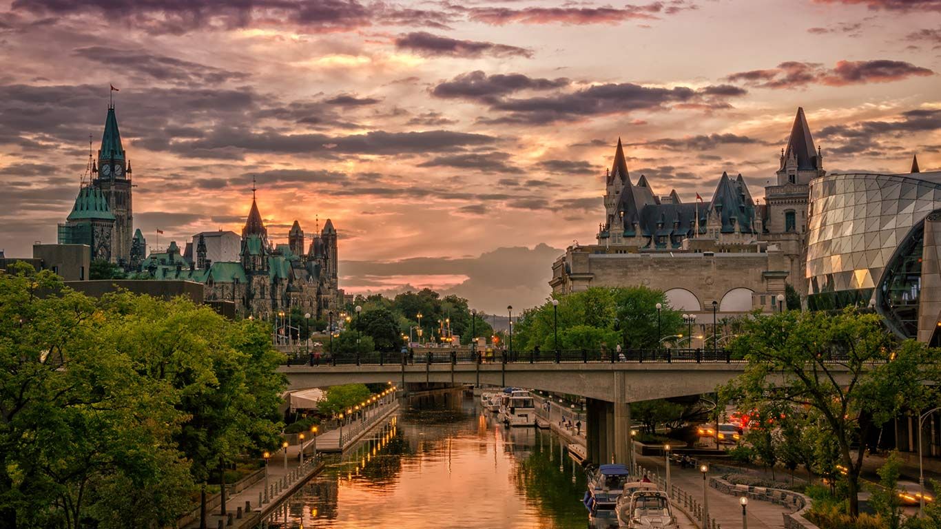 Rideau Canal at sunset with Chateau Laurier in the background, Ottawa, Canada