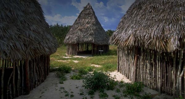 Replica huts at Guanahani Landfall Park on San Salvador island in the Bahamas