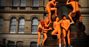 Street performers climbing statue for the Edinburgh Festival, Edinburgh, Scotland -- Will Salter/Lonely Planet Publications Ltd &copy; (Bing United Kingdom)