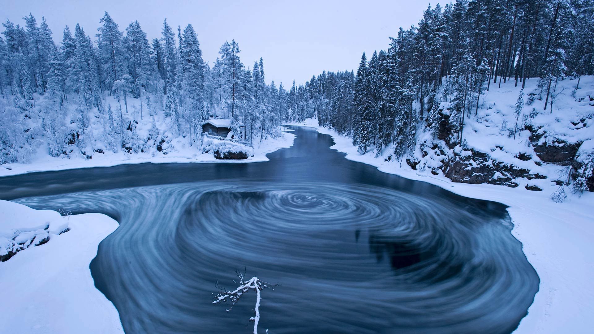 The whirlpool in Myllykoski scenic area at winter in Oulanka National Park, Kuusamo, Finland