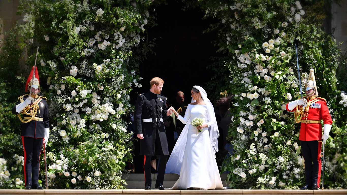 Prince Harry and Meghan Markle leave after their wedding ceremony at St. George's Chapel in Windsor Castle in Windsor