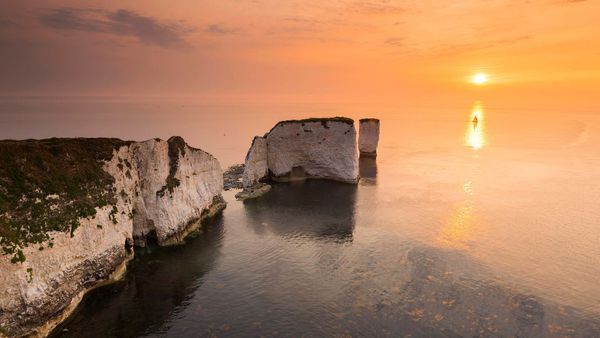 Sunrise at the chalk pinnacles of Old Harry Rocks, near Studland, Dorset