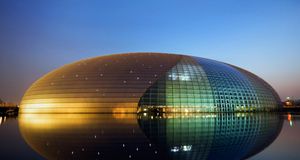 An illuminated Centre for the Performing Arts in Beijing, China (© Christian Kober/Corbis) &copy; (Bing United States)