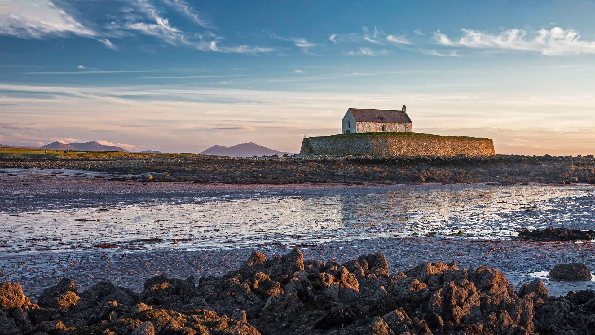 St Cwyfans Church, Anglesey at low tide.