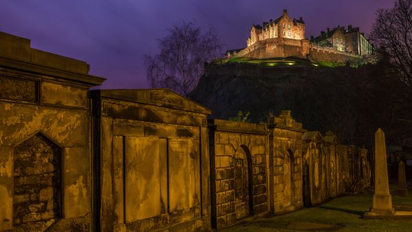 View of Edinburgh Castle from a churchyard in Scotland, United Kingdom