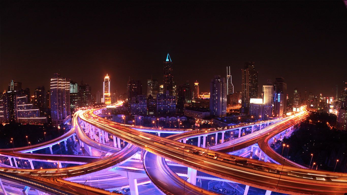 Shanghai's roadways and skyline lit up at night